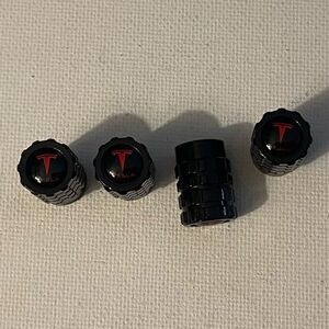 Tesla valve Stem caps in black set of 4 NWT